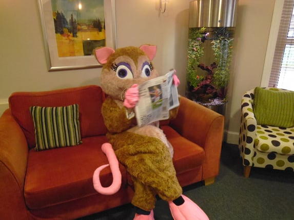 Titch, the Field Mouse, checks local press for news about Titchfield Dental Health.jpg
